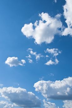 Clouds on a blue sky, vertical shot