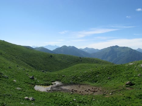 Mountains, rocks; a relief; a landscape; a hill; a panorama; Caucasus; top; a slope; clouds; the sky; a landscape