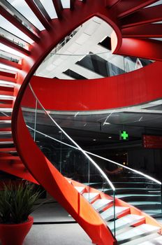 Red spiral staircase in an airport