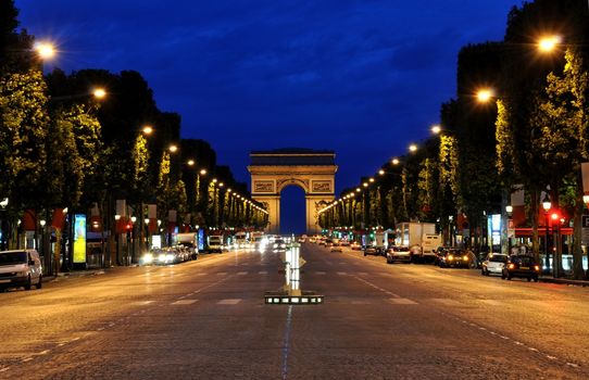 The Champs-Eelysees and the Arc de Triomphe in Parisduring the night
