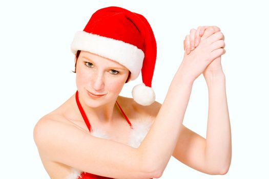 Beautifull girl in christmas bikini and christmas hat celebrating. With background clipping path for your convenience 