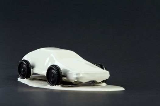 Small copies of sports automobiles filled with a paint