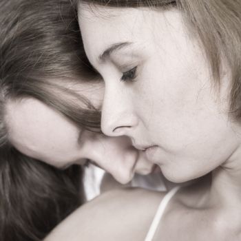 two beauty girlfriends in lingerie in the photo studio 