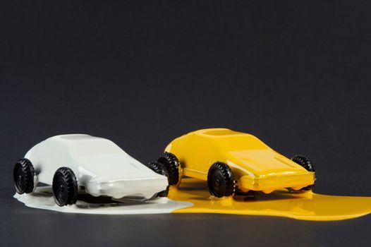 Small copies of sports automobiles filled with a paint