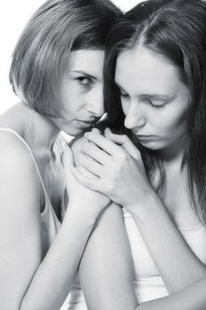 two beauty girlfriends in lingerie in the photo studio 