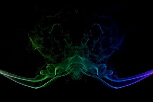 abstract picture of coloured smoke on the black background