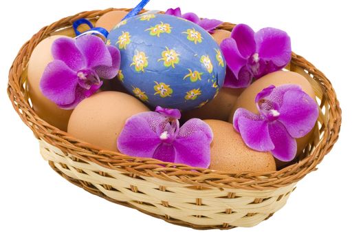 a basket of colourful easter eggs isolated on the white background
