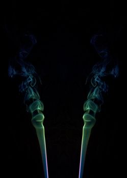 abstract picture of coloured smoke on the black background