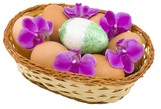 a basket of colourful easter eggs isolated on the white background