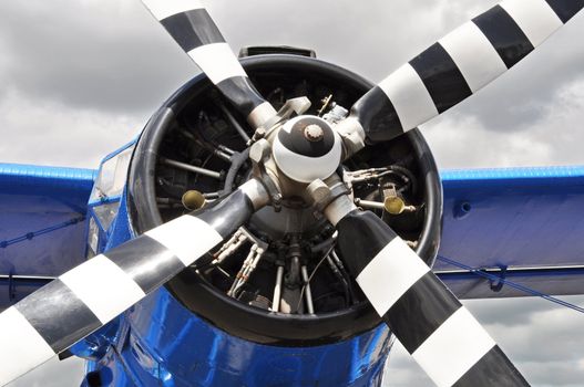 A vintage blue propeller airplane