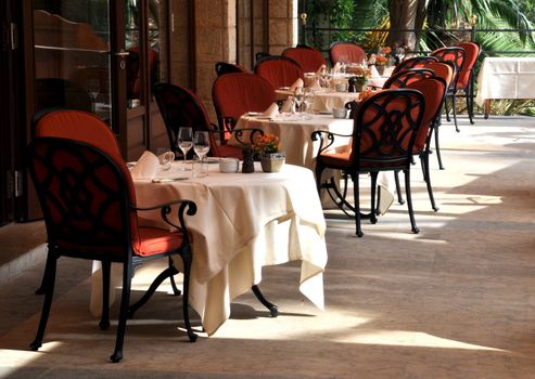 A gourmet restaurant terrace on a sunny day