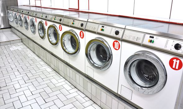 Row of washing machines in a laundrette