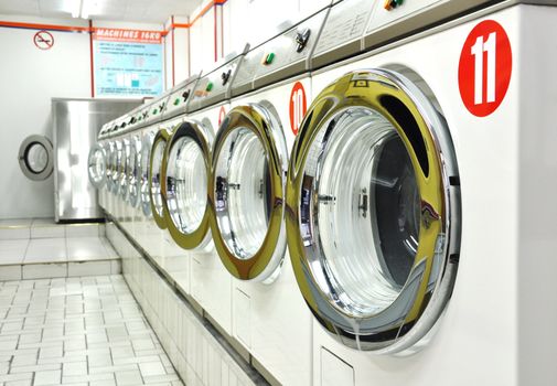 Row of washing machines in a laundrette