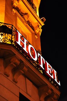 Parisian hotel facade at night