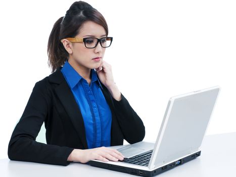 Portrait of a cute young businesswoman using laptop over white background.