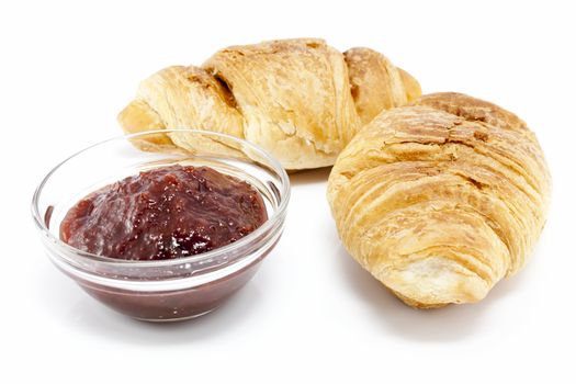 Two croissants with plum jam