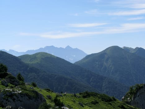 Mountains, rocks; a relief; a landscape; a hill; a panorama; Caucasus; top; a slope; clouds; the sky; a landscape