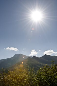 Hard sun above French mountains in the Pyrenees area