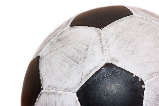 A used soccer ball over white background.