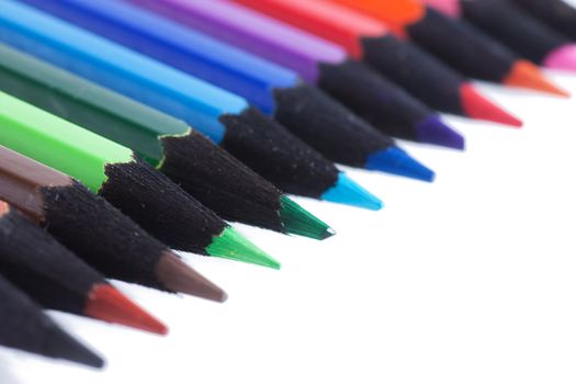 Colored pencils isolated over white background