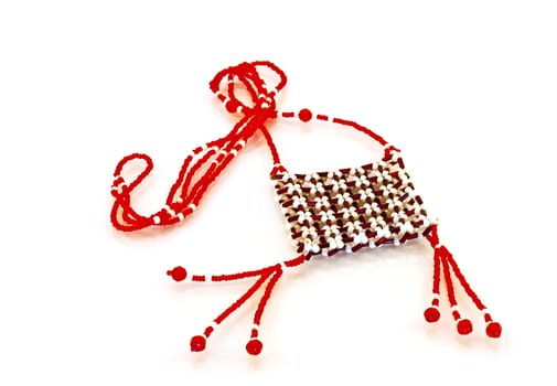 Bunch of red and bright beads on a white background
