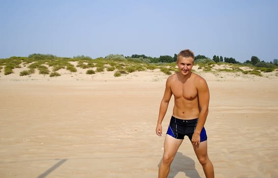 tan guy on the beach