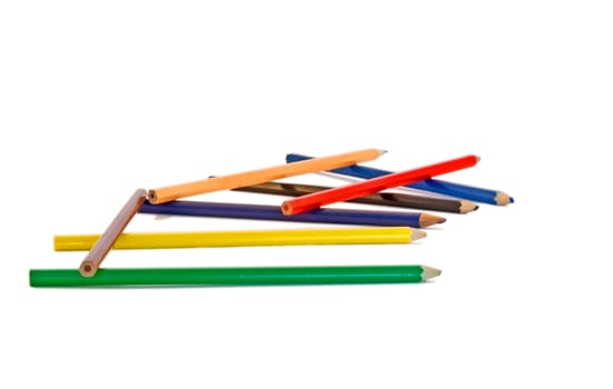 Pencils scattered on a white background.