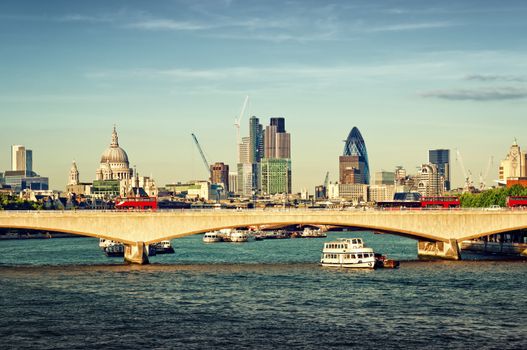 City of London in late afternoon light. This view includes: St. Paul`s Cathedral, The Gherkin, Tower 42, and Waterloo Bridge. 