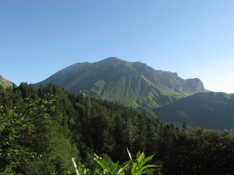 Mountains, rocks; a relief; a landscape; a hill; a panorama; Caucasus; top; a slope; clouds; the sky; a landscape