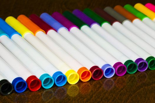 Back to school, set of color markers on the table.