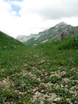 Mountains, rocks; a relief; a landscape; a hill; a panorama; Caucasus; top; a slope; clouds; the sky; a landscape