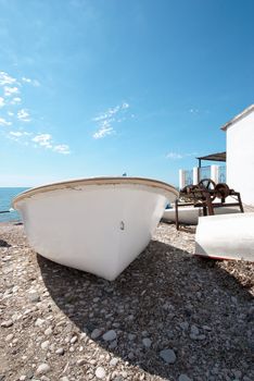 Traditional fishing boats ashore on a Mediterranean beach