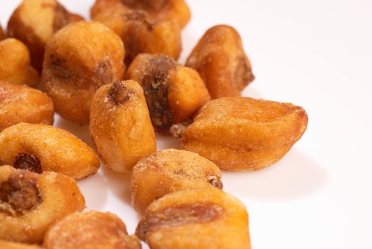 Freslhy fried corn seeds isolated with copy space