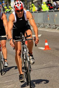 GENEVA, SWITZERLAND - JULY 24 : one unidentified male racing cyclist after the swimm race at the international Geneva Triathlon, on july 24, 2011 in Geneva, Switzerland