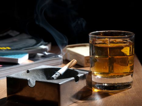 whisky and cigarettes, unhealthy lifestile, lonely drinking at night