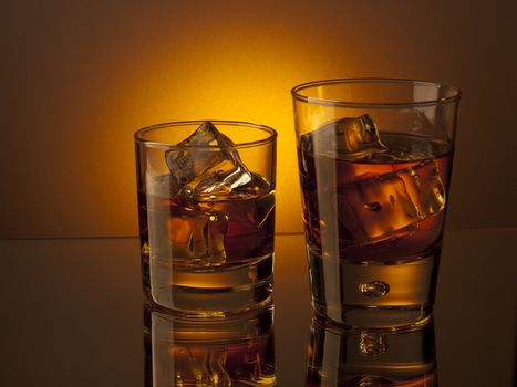 Two glasses of whiskey on the rocks