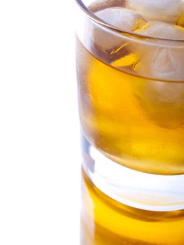 Glass of whiskey on white background, close-uo