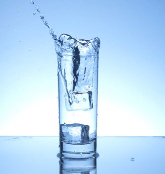 Ice cube entering water with a splash