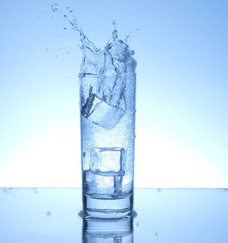 Ice cube entering water with a splash