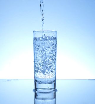 Water pouring in a glass 