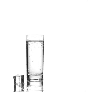 Glass of water on white with reflection