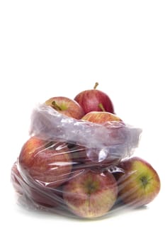 A plastic bag full of apples