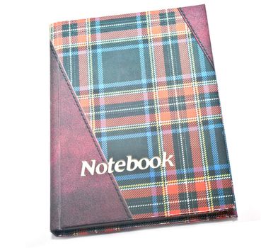 Isolated colored notebook on white background .