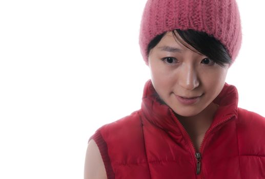 Pretty young asian woman with a red winter jacket and a nice red cap