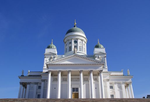 Helsinki Cathedral, the landmark of Helsinki, a frontal view against blue sky.