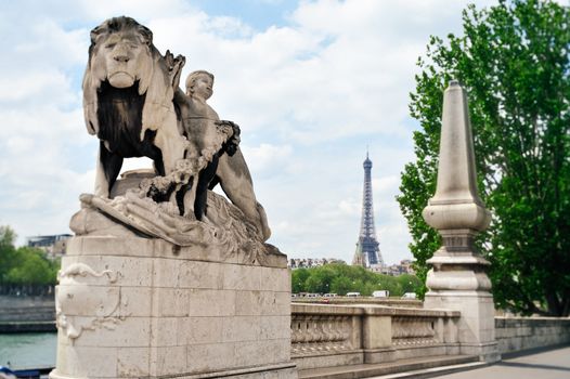 Statue of a lion on Alexander's bridge III. Photo with tilt-shift effect