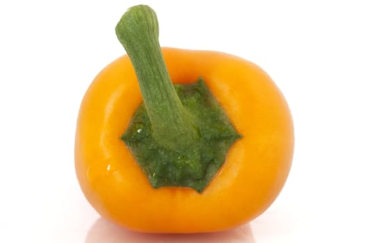 Closeup of top of orange pepper.