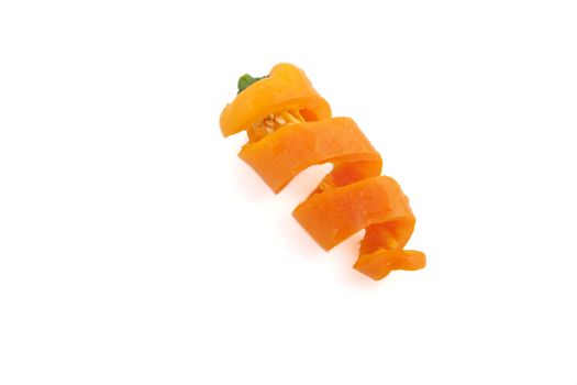 Sweet orange pepper cut into curls and isolated on white.