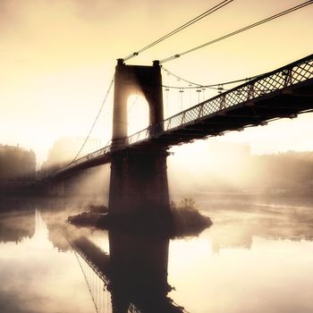 sunset on footbridge in Lyon city in France