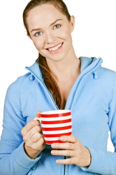 Portrait of a beautiful young smiling woman holding a cup of coffee or tea. Isolated over white.